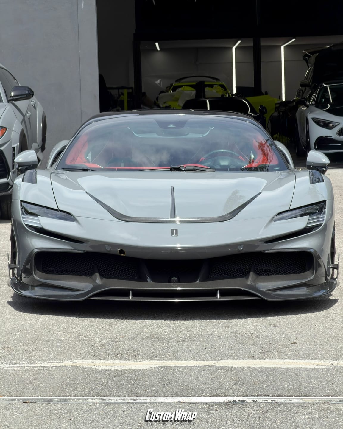 Ferrari SF90 Mansory wrapped in 3M High Gloss Nardo Gray, front view