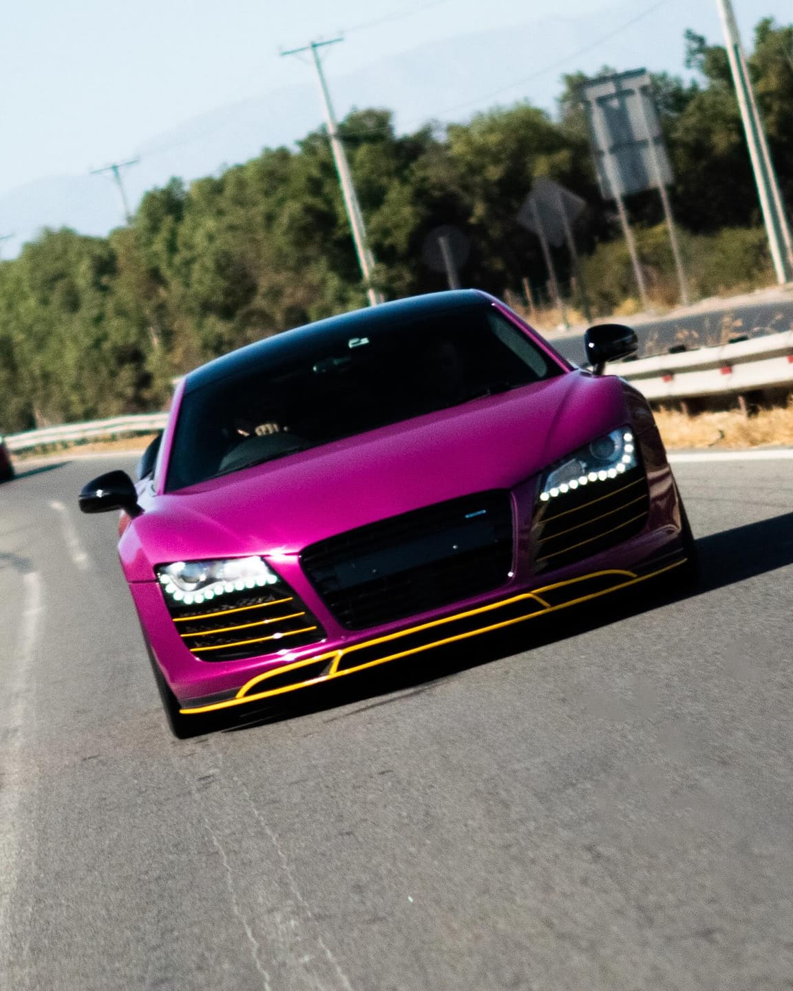 Audi R8 wrapped in Berry Purple with yellow details, on the road