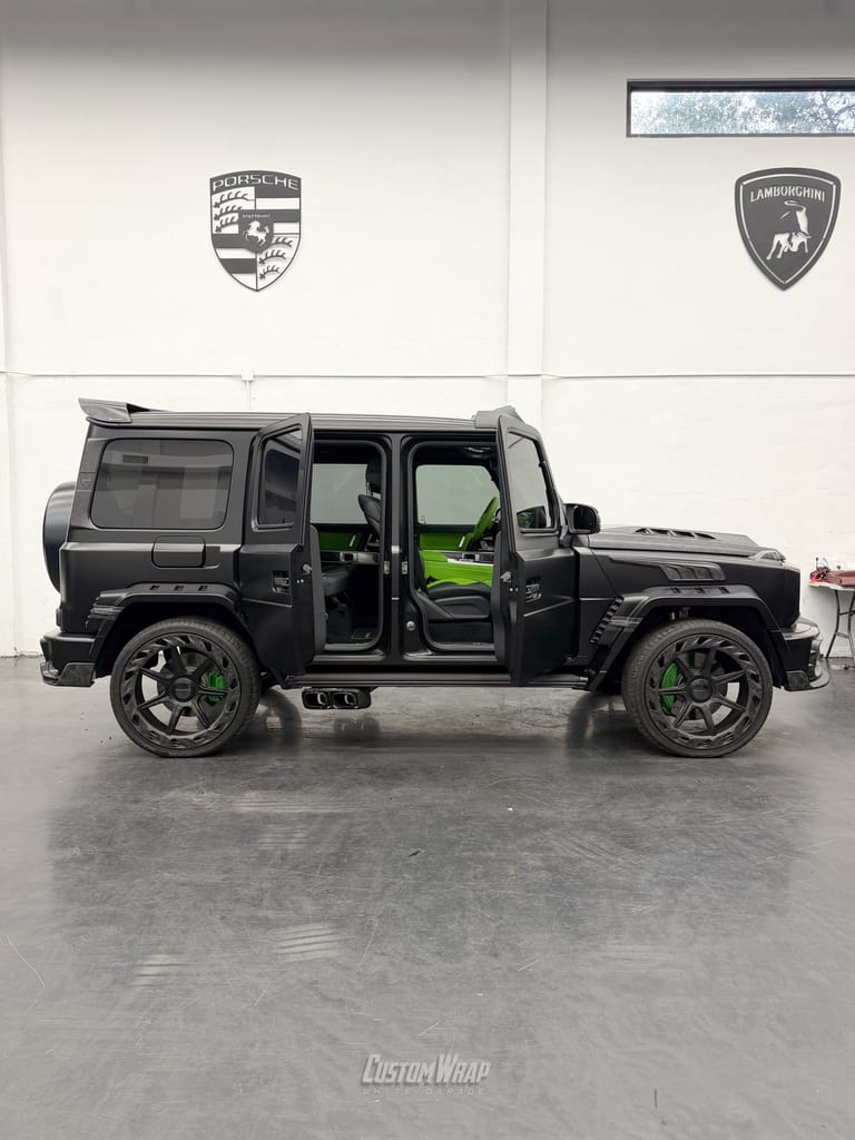 Mercedes-Benz G-Class Mansory wrapped in Satin Black, side on with its doors open