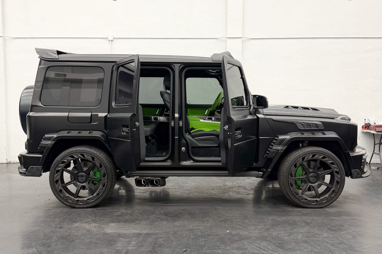 Mercedes-Benz G-Class Mansory wrapped in Satin Black, side on with its doors open